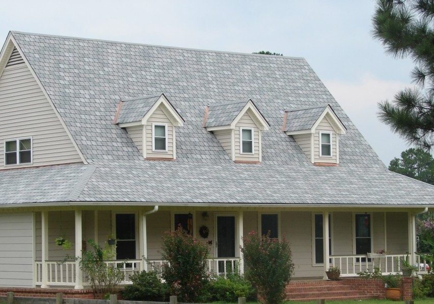roof-installation_orig Suburban house with gabled roof and porch.